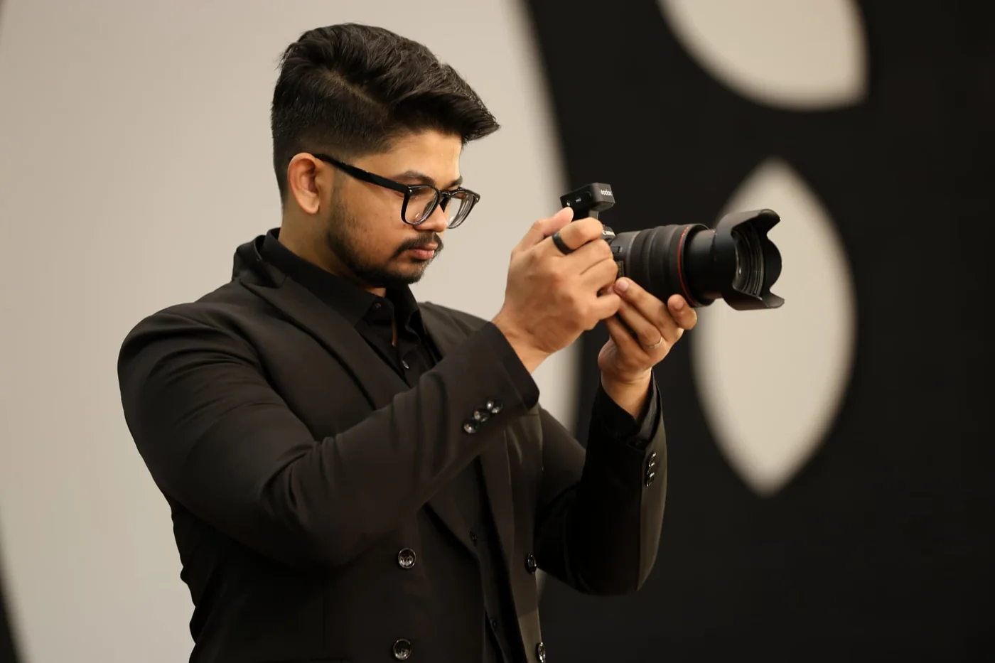 Varun Vinod working with a camera