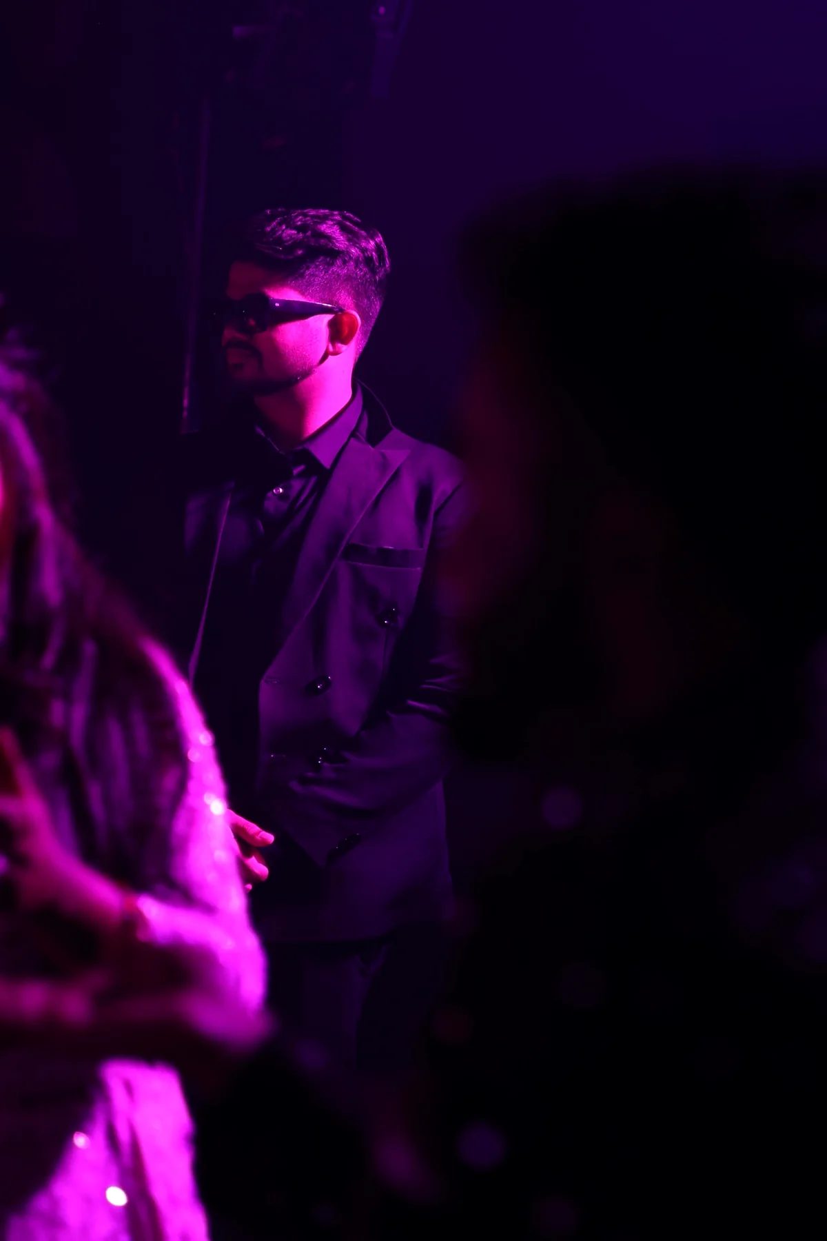 Varun Vinod backstage under event lighting
