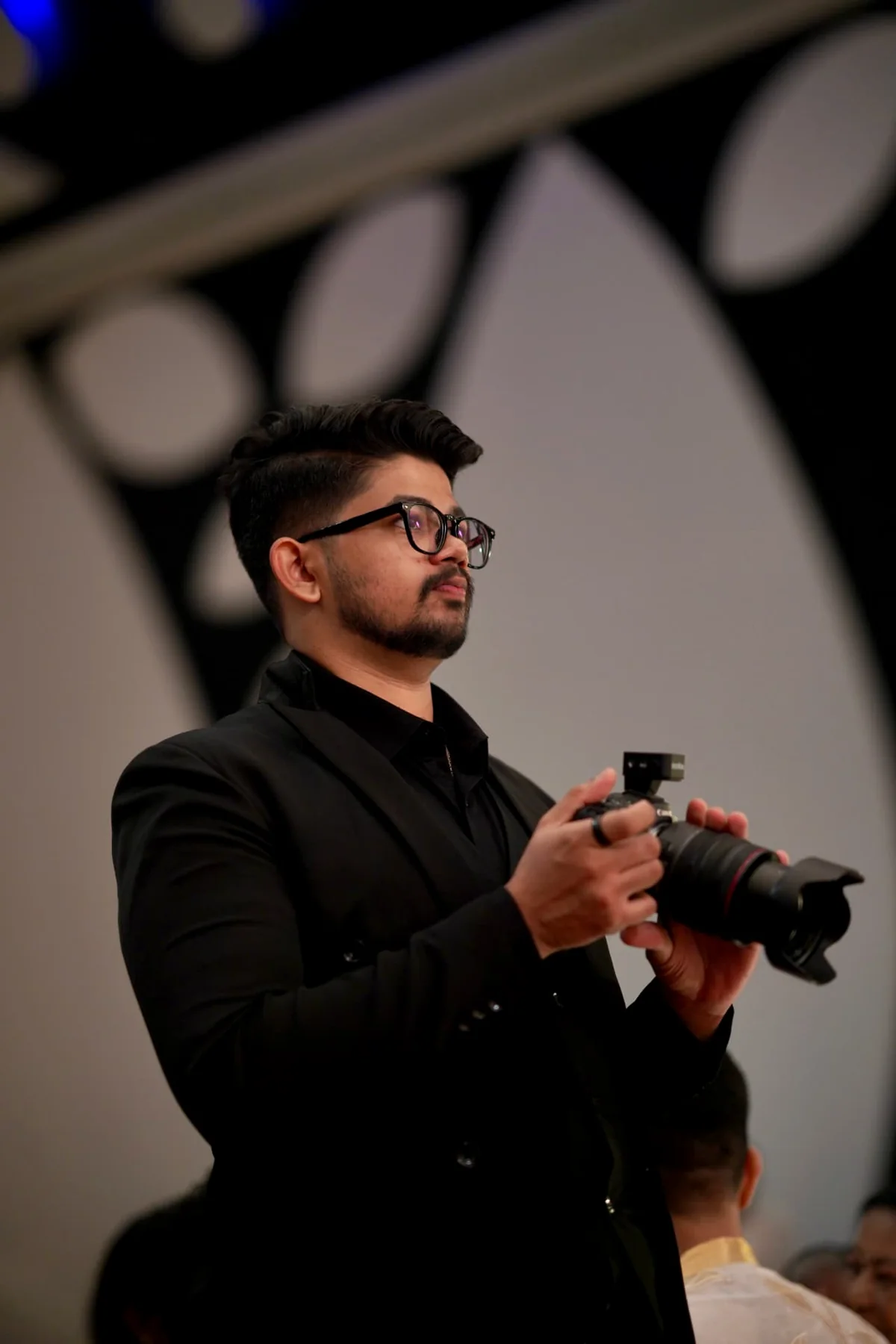 Varun Vinod photographing an event