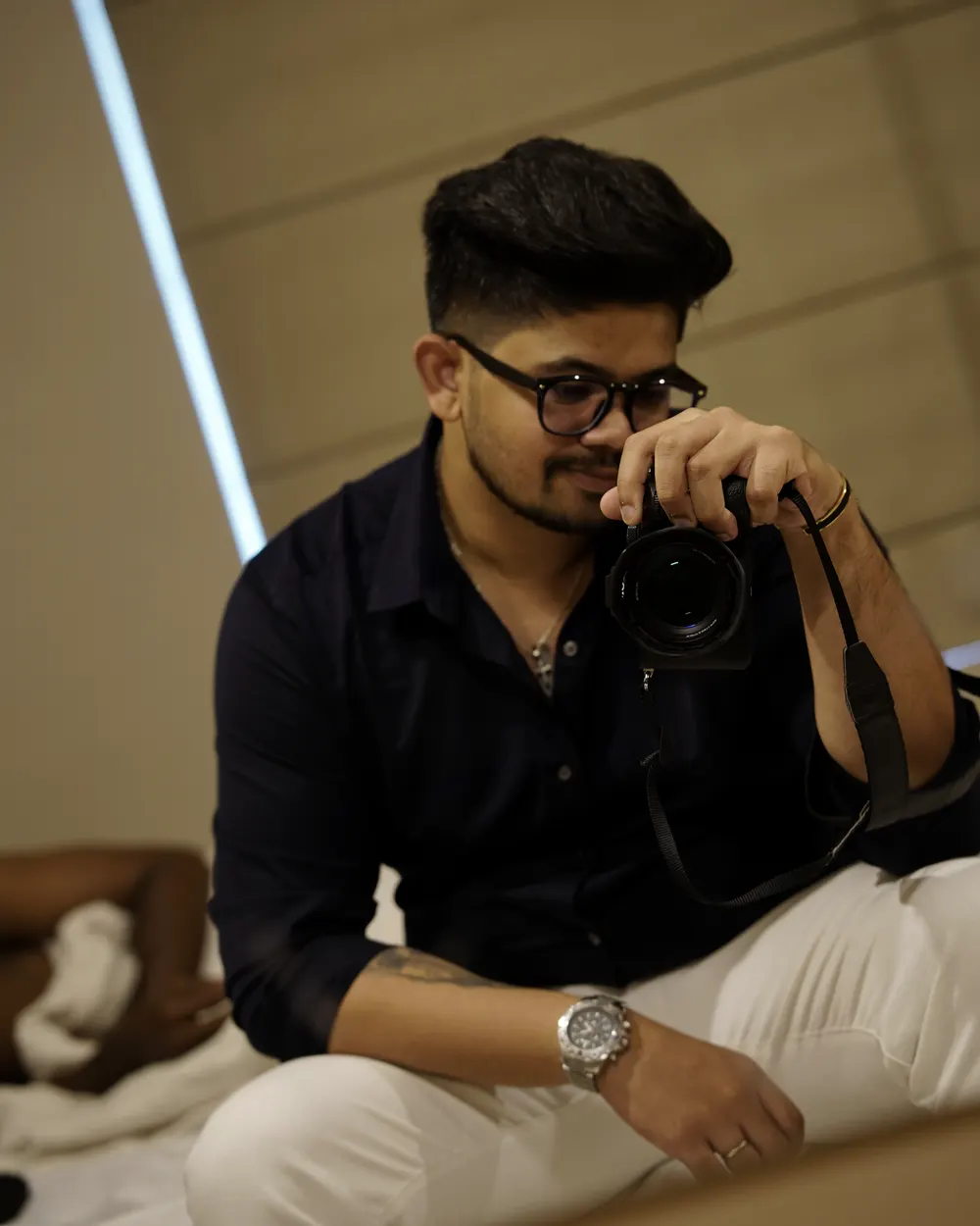 Varun Vinod with a camera at an event